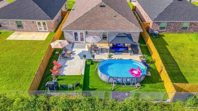 single story home with a front yard and a garage