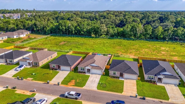 aerial view featuring a residential view and a forest view