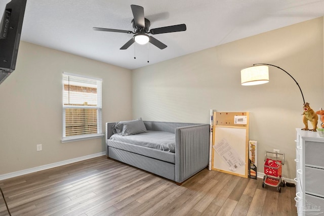 bedroom featuring ceiling fan and hardwood / wood-style flooring