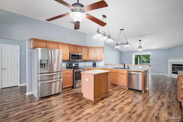 7292 Broadmoor St, Navarre, FL 32566 - kitchen with stainless steel appliances, ceiling fan, a peninsula, light countertops, and dark wood-type flooring