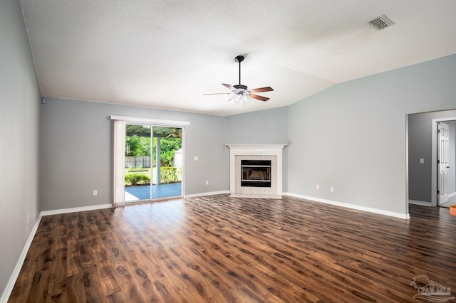 7292 Broadmoor St, Navarre, FL 32566 - unfurnished living room featuring a ceiling fan, vaulted ceiling, dark wood-type flooring, and a fireplace