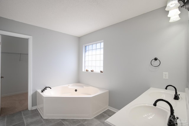 7292 Broadmoor St, Navarre, FL 32566 - full bath with a garden tub, tile patterned flooring, double vanity, and a spacious closet
