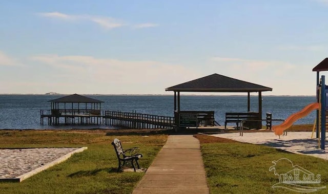 7292 Broadmoor St, Navarre, FL 32566 - dock featuring a gazebo, a water view, and a lawn
