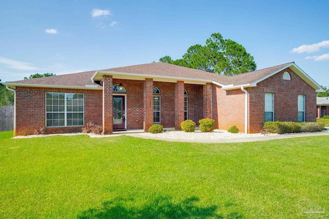 7292 Broadmoor St, Navarre, FL 32566 - single story home featuring a front yard, brick siding, and a shingled roof