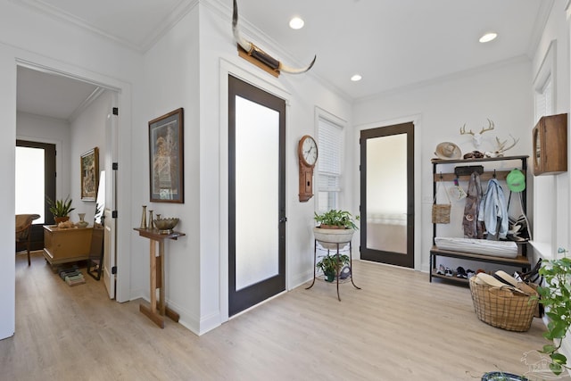 entrance foyer with baseboards, recessed lighting, light wood-type flooring, and crown molding