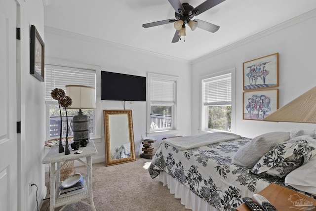 carpeted bedroom featuring crown molding and baseboards