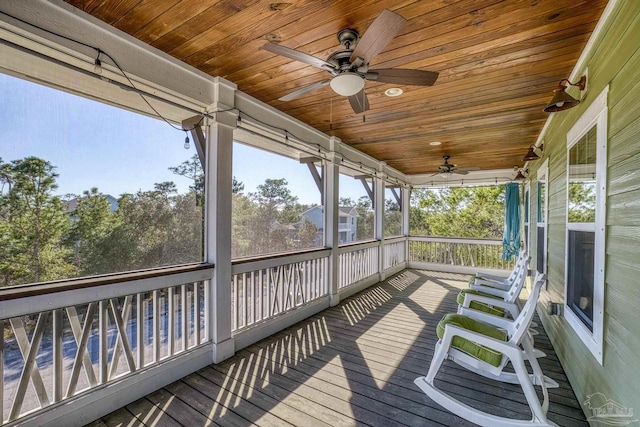 deck with a porch and a ceiling fan