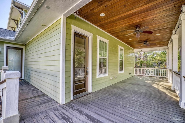 deck featuring covered porch and a ceiling fan