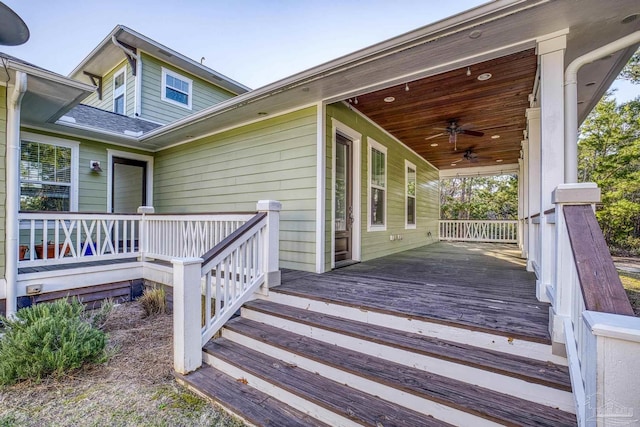 wooden deck featuring a porch and a ceiling fan