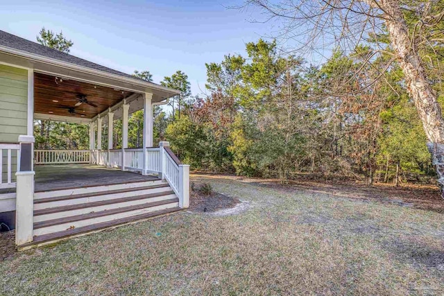 view of yard with ceiling fan