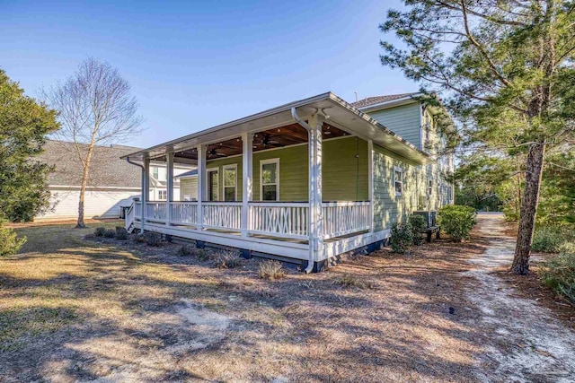 view of front of property with ceiling fan and a porch