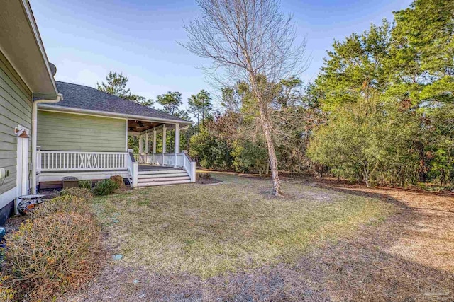 view of yard featuring covered porch