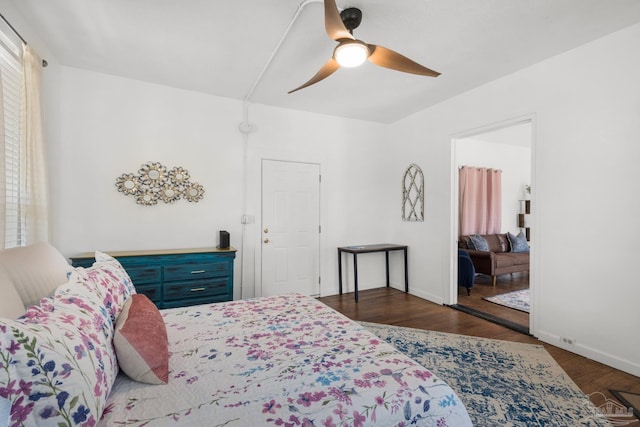 bedroom featuring ceiling fan and dark hardwood / wood-style flooring