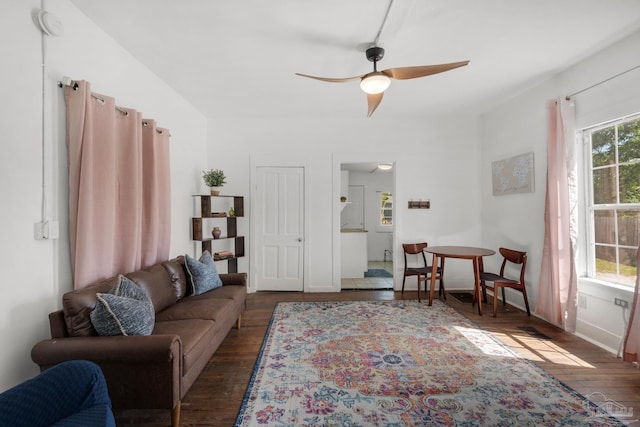 living room with ceiling fan and dark hardwood / wood-style floors