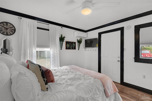 bedroom featuring ceiling fan, ornamental molding, hardwood / wood-style floors, and a wall mounted AC