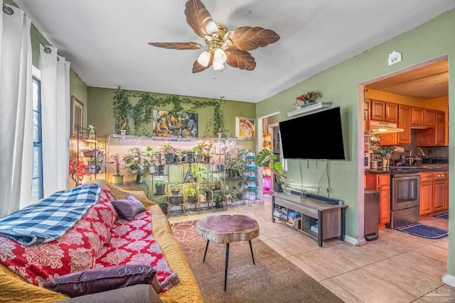 tiled living room featuring plenty of natural light and ceiling fan