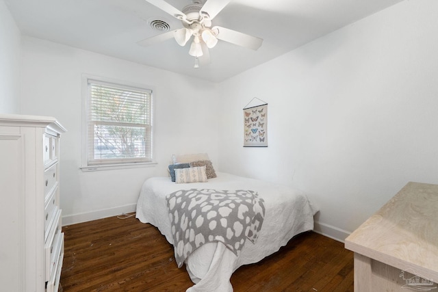 bedroom with dark wood-type flooring and ceiling fan