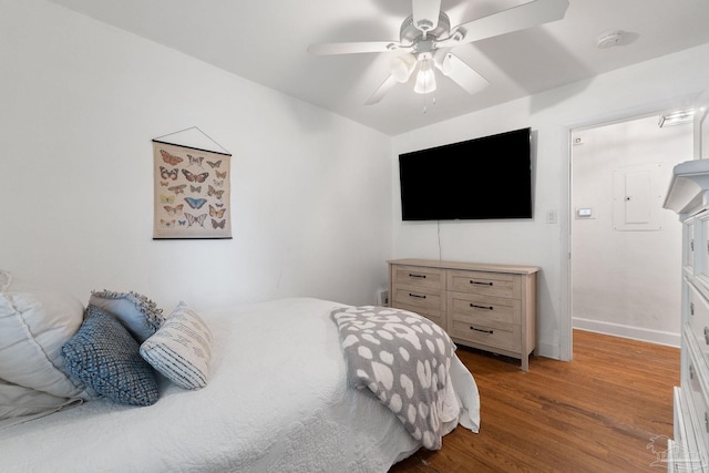 bedroom featuring hardwood / wood-style floors and ceiling fan