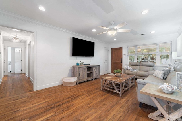 living room featuring ceiling fan, dark hardwood / wood-style floors, and ornamental molding