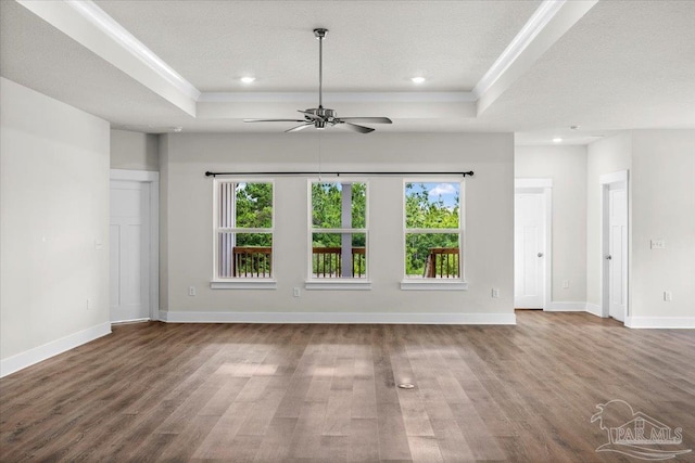 10826 Blacktail Loop, Pensacola, FL 32526 - unfurnished living room with a raised ceiling, crown molding, wood finished floors, a ceiling fan, and recessed lighting