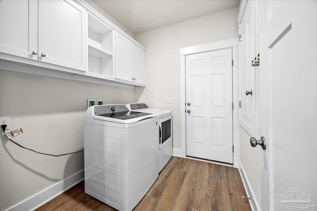 10826 Blacktail Loop, Pensacola, FL 32526 - washroom with washer and dryer, cabinet space, dark wood-style flooring, and baseboards