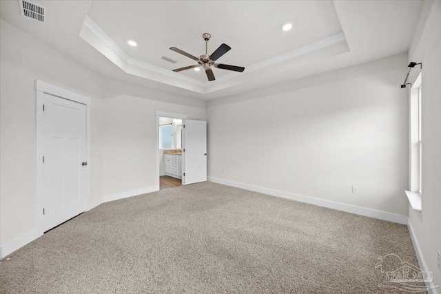 10826 Blacktail Loop, Pensacola, FL 32526 - unfurnished bedroom with a tray ceiling, carpet flooring, baseboards, recessed lighting, and ensuite bathroom