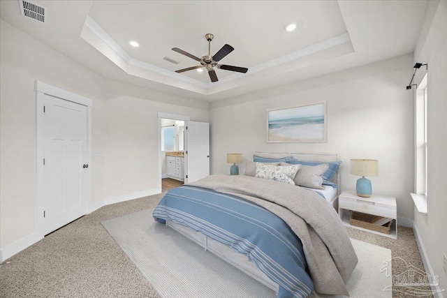 10826 Blacktail Loop, Pensacola, FL 32526 - carpeted bedroom featuring a tray ceiling, baseboards, recessed lighting, multiple windows, and connected bathroom