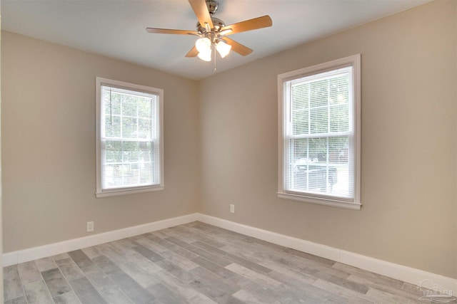 unfurnished room with light wood-type flooring and ceiling fan