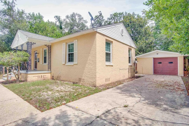 view of side of property with a garage and an outdoor structure