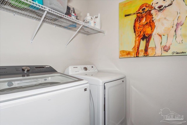 washroom featuring washer and dryer