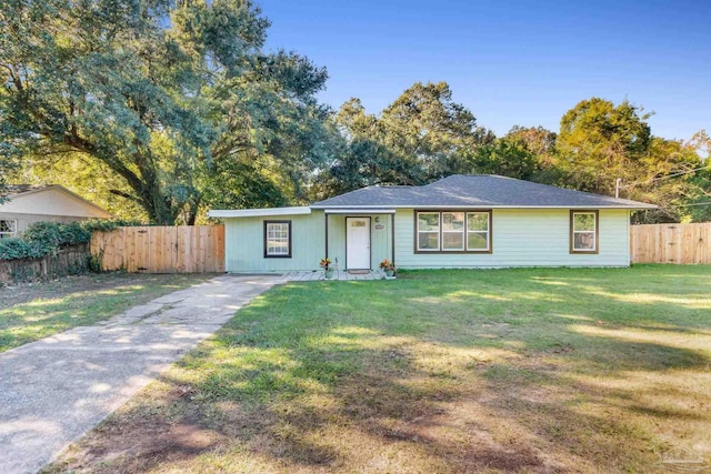 ranch-style home with a front lawn