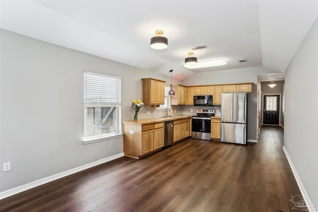 kitchen featuring visible vents, light countertops, a sink, lofted ceiling, and stainless steel appliances