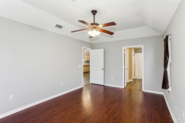 unfurnished bedroom with wood finished floors, ceiling fan, baseboards, and visible vents