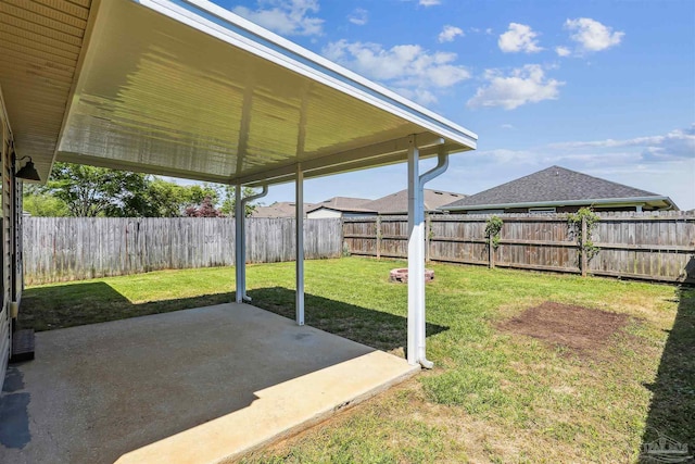 view of yard with a patio area and a fenced backyard