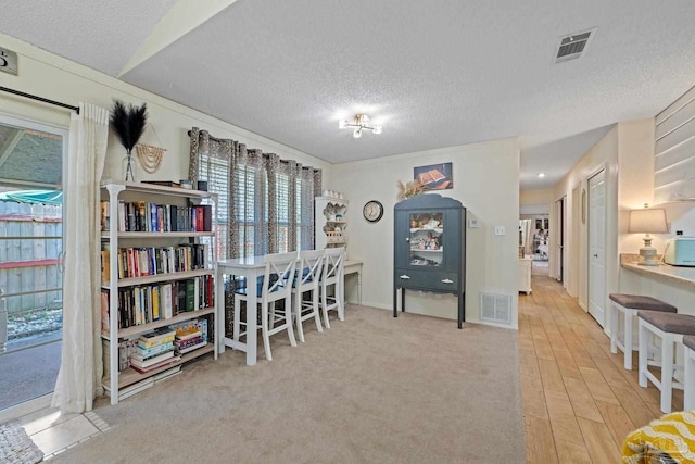 interior space with visible vents and a textured ceiling