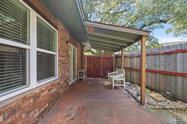 view of patio / terrace featuring a gate and fence