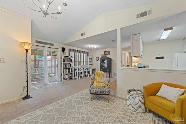 sitting room with lofted ceiling, carpet flooring, baseboards, and visible vents