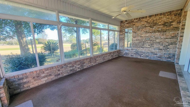 unfurnished sunroom featuring ceiling fan