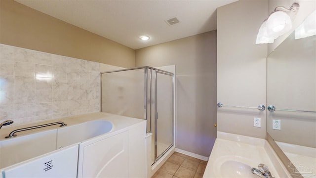 bathroom with tile patterned flooring, vanity, and an enclosed shower