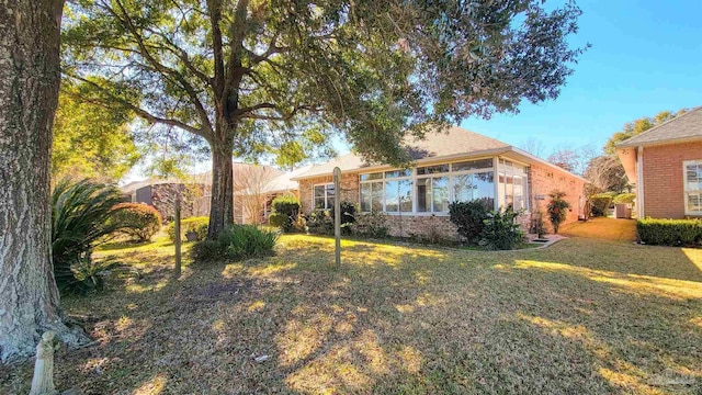 ranch-style home with a front yard