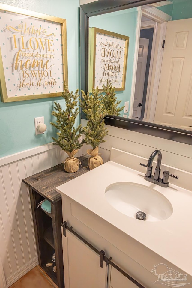 10129 Huntsman Path, Pensacola, FL 32514 - bathroom with vanity, a decorative wall, and a wainscoted wall
