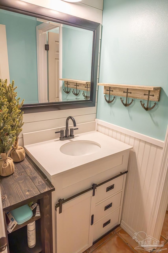 10129 Huntsman Path, Pensacola, FL 32514 - bathroom featuring vanity and a wainscoted wall