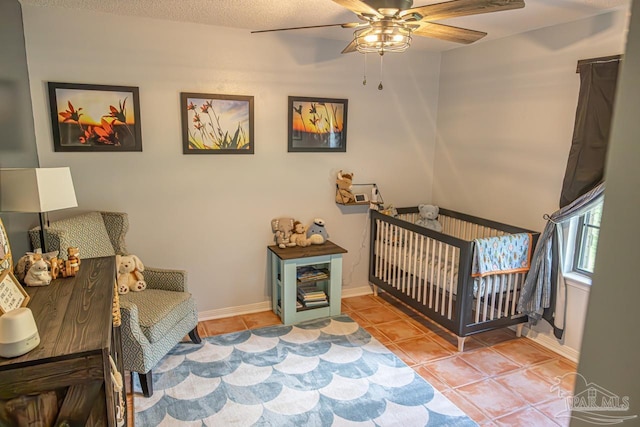 10129 Huntsman Path, Pensacola, FL 32514 - tiled bedroom featuring baseboards and ceiling fan