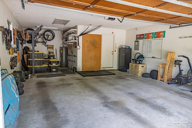 10129 Huntsman Path, Pensacola, FL 32514 - garage with water heater, a garage door opener, and freestanding refrigerator