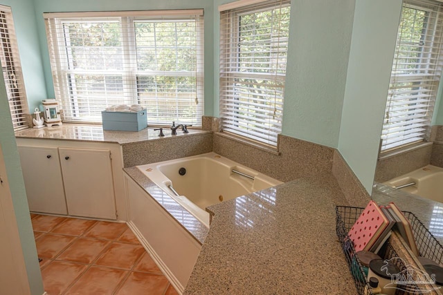 10129 Huntsman Path, Pensacola, FL 32514 - bathroom with tile patterned flooring, a tub with jets, and a wealth of natural light