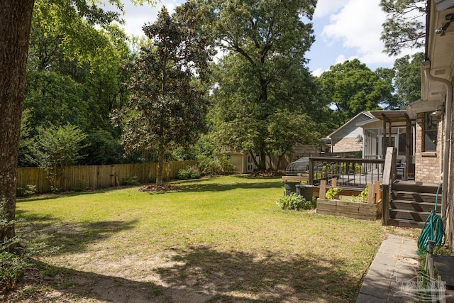 10129 Huntsman Path, Pensacola, FL 32514 - view of yard with a fenced backyard and a deck