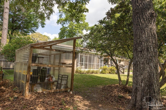 10129 Huntsman Path, Pensacola, FL 32514 - view of yard with an outdoor structure and a greenhouse
