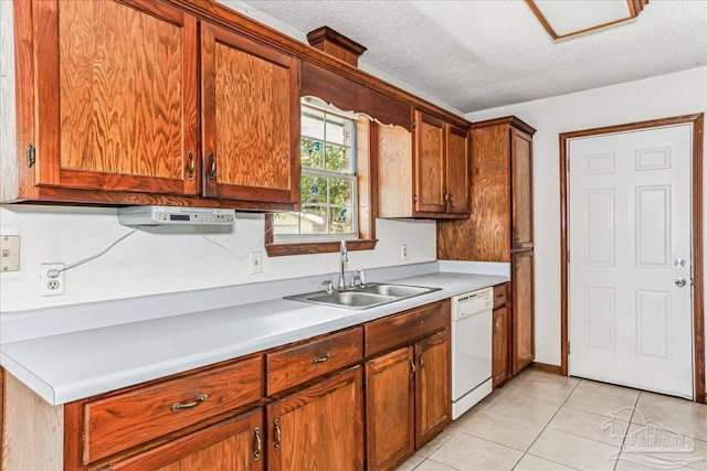 5471 Shamrock St, Milton, FL 32570 - kitchen featuring dishwasher, a sink, a textured ceiling, light tile patterned floors, and light countertops