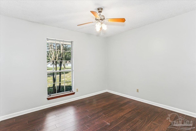 5471 Shamrock St, Milton, FL 32570 - spare room with dark wood-type flooring, baseboards, and a ceiling fan