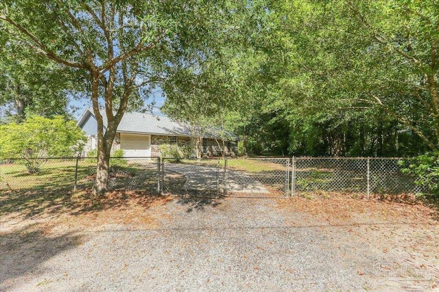 5471 Shamrock St, Milton, FL 32570 - view of front of house with a gate